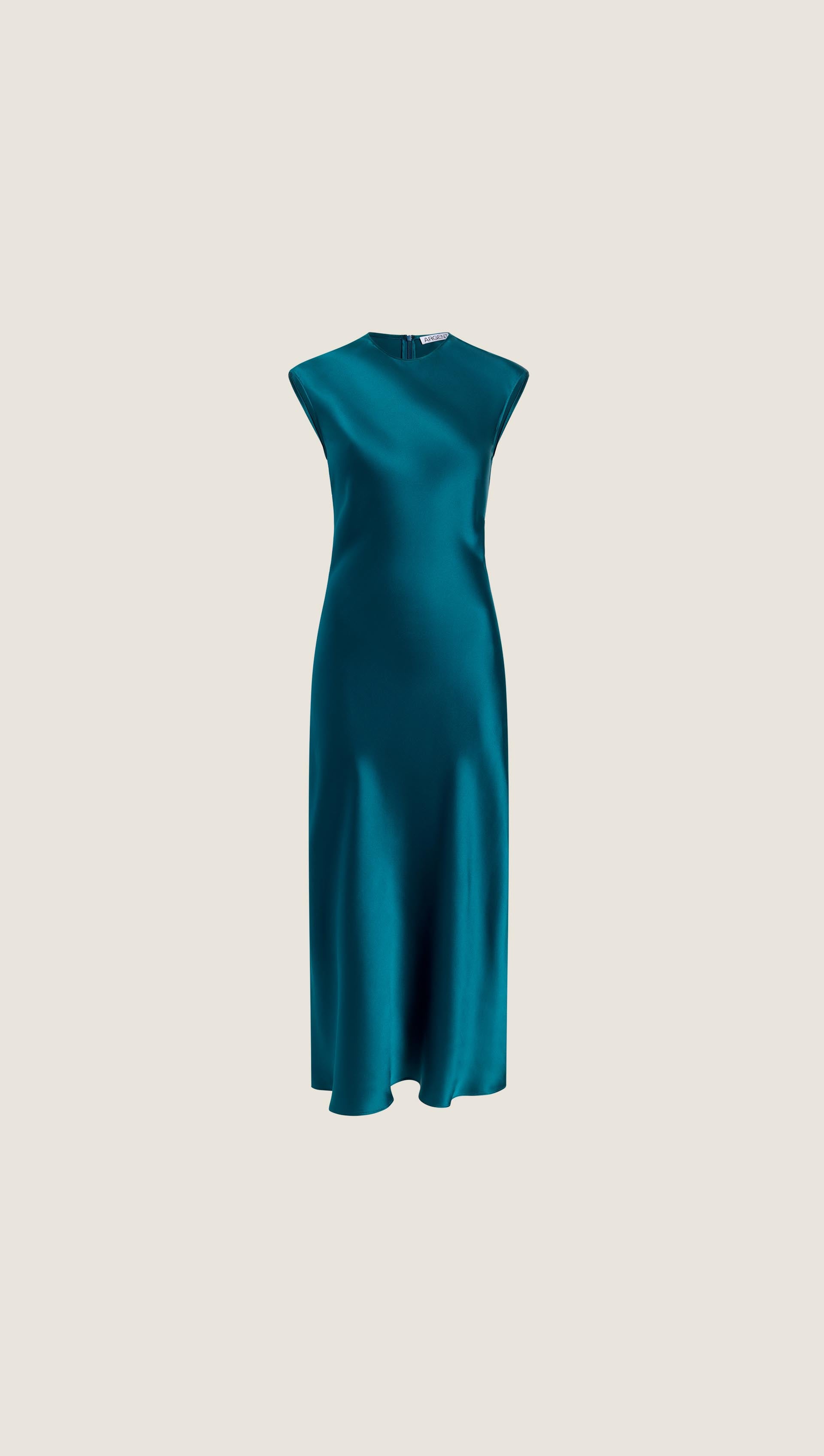 women teal dress on the bias designs The Cloud Nine Dress embodies elegance with its luxurious rayon silk fabric and exclusive SACHA DRAKE print. The bias-cut A-line silhouette flows effortlessly, complemented by a V-neck and